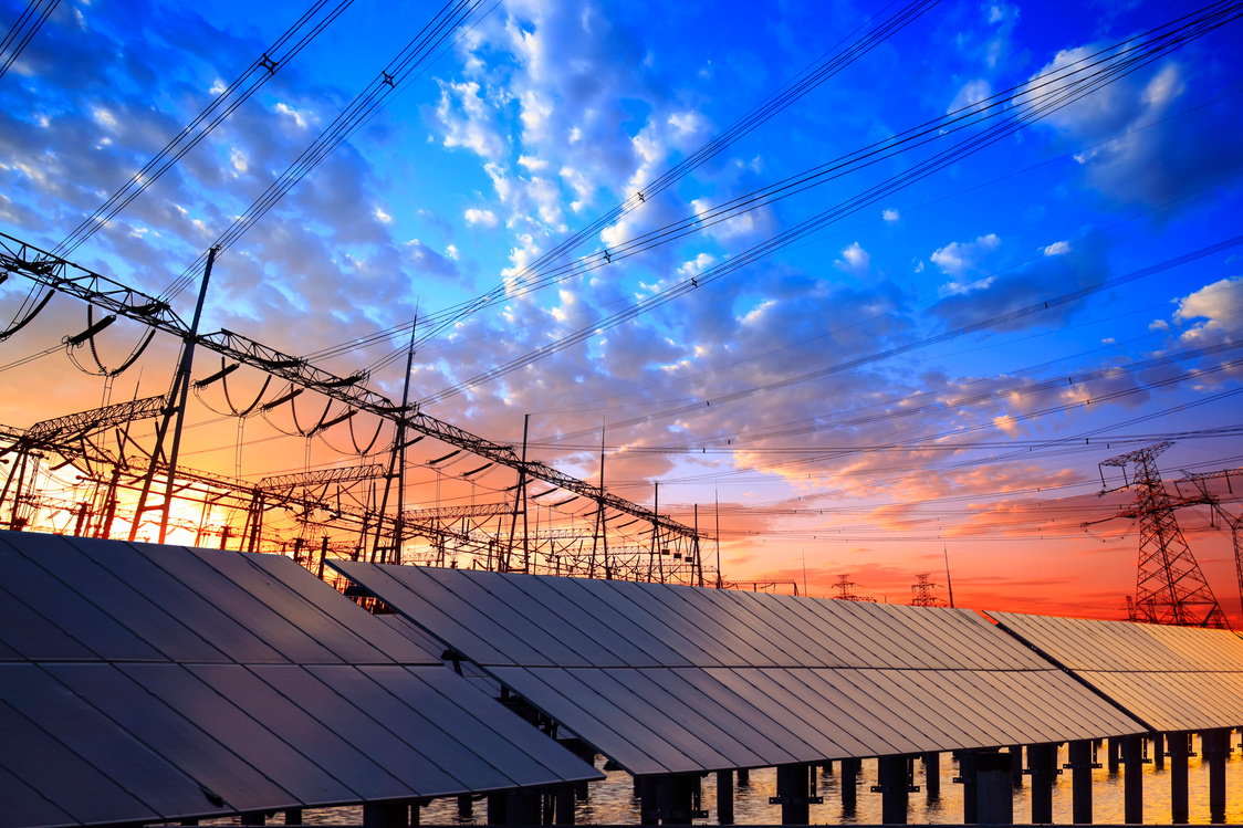 Solar photovoltaic panels and substations in the evening